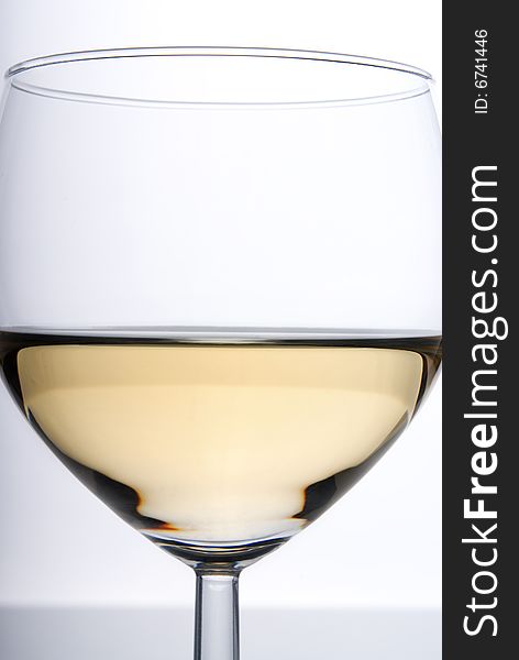 Glass of white wine, tightly cropped, with a white background. Glass of white wine, tightly cropped, with a white background.