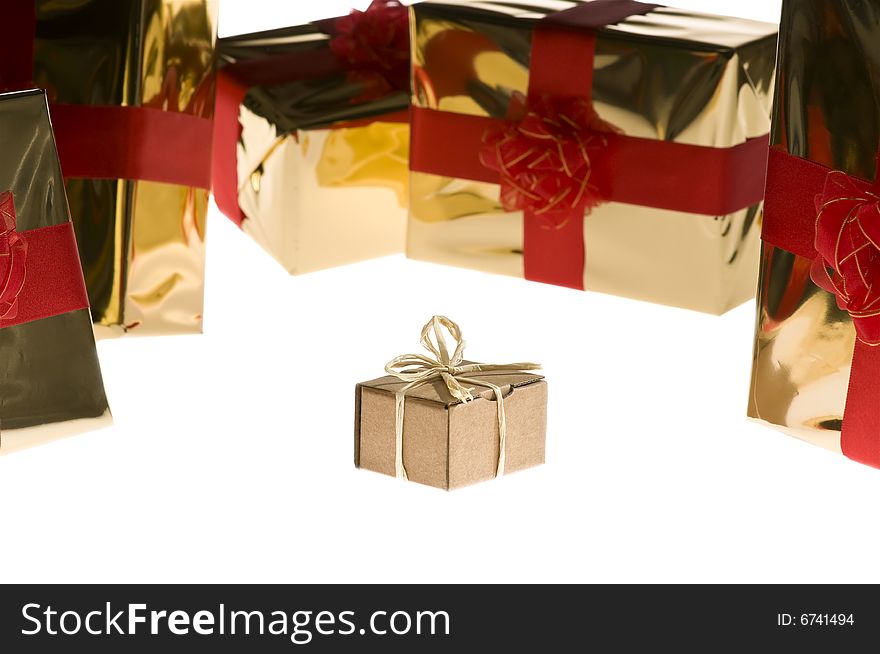Christmas present isolated on white background surrounded by glossy wrapped presents