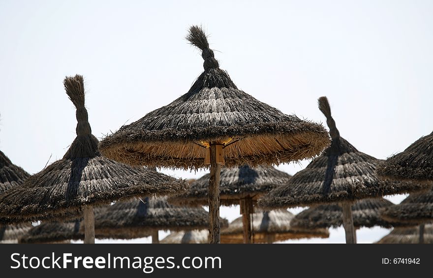 Straw umbrellas on the beach