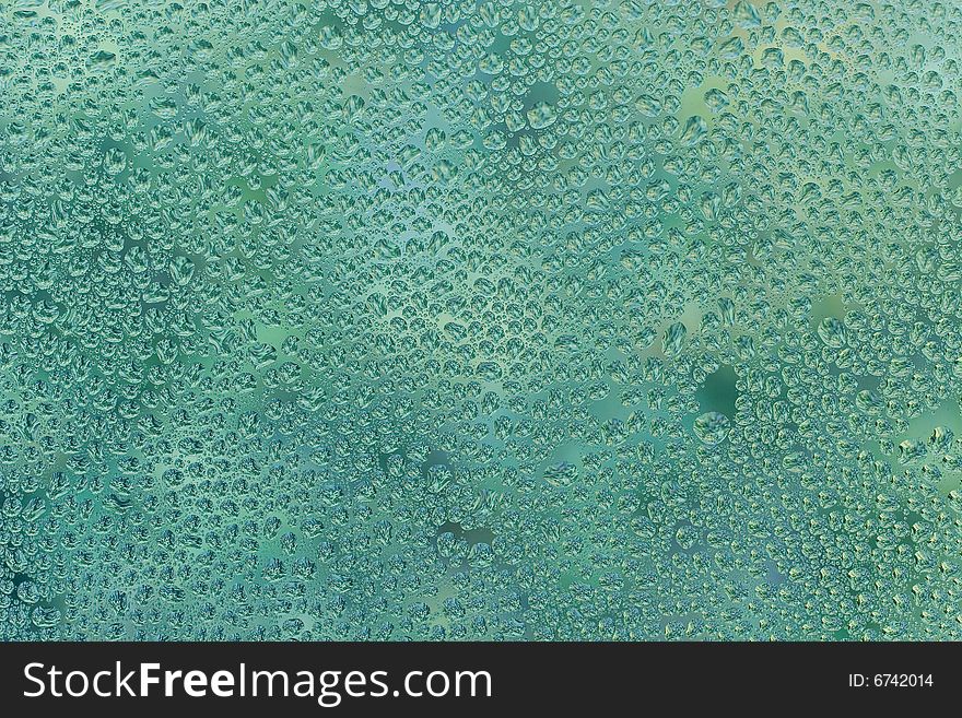 Abstract green background (raindrops on green glass)