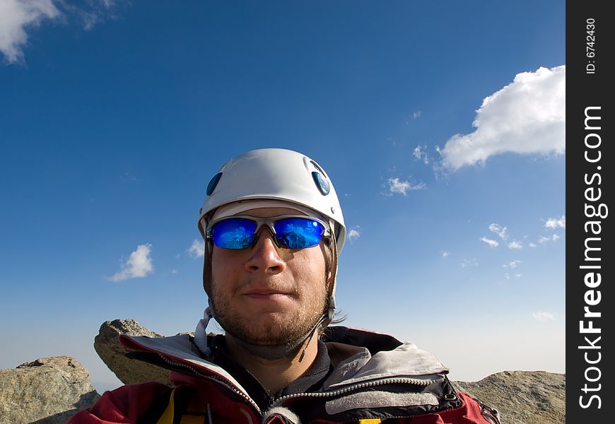 Climber on the top of mountain.