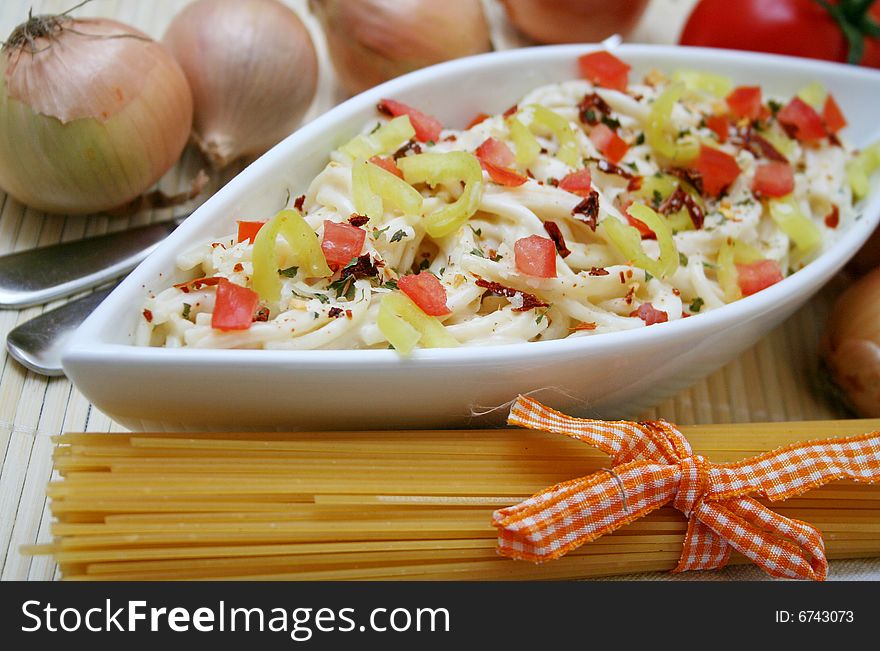 Fresh italian pasta with cheese-sauce and pepper