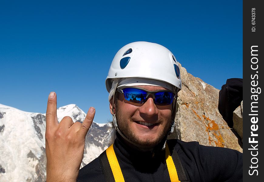 Climber on the top of mountain.