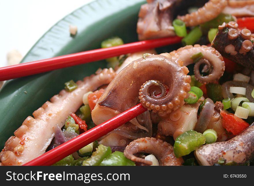 A salat of octopus with some vegetables
