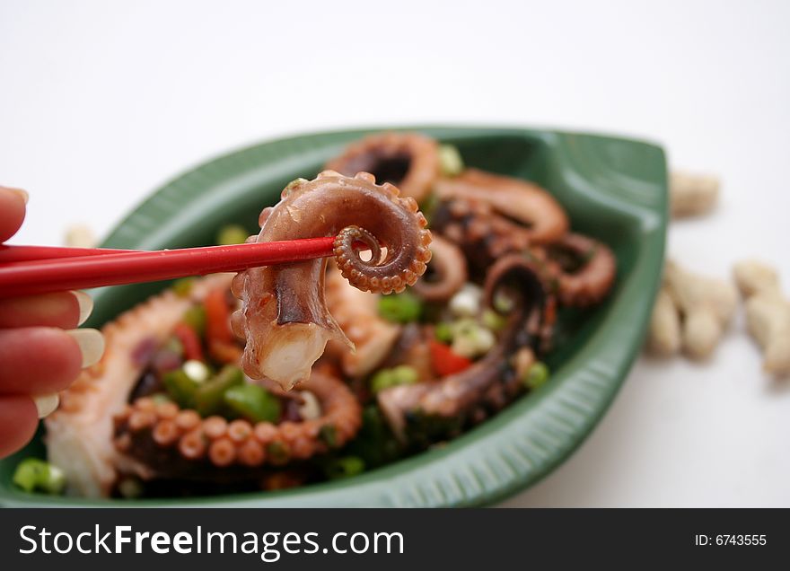 A salat of octopus with some vegetables