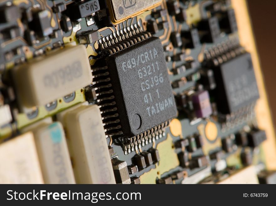 A close up shot of a microchip on a circuit board