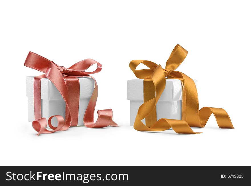 Two present boxes with ribbons isolated on white background