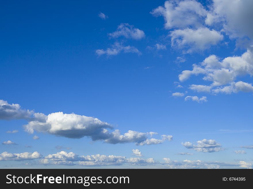 Fluffy white clouds in a blue sky. Fluffy white clouds in a blue sky