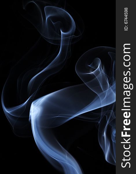 Abstract colored smoke on a black background