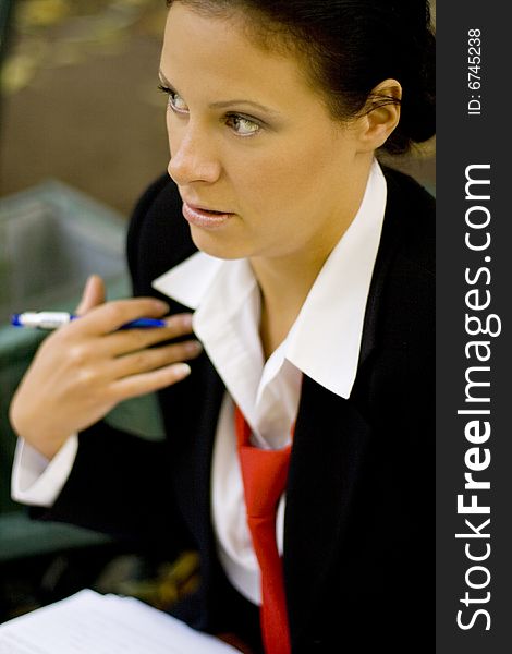 Outdoor portrait of businesswoman with documents