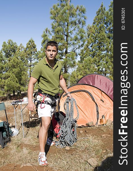 Man Standing Near His Tent With Clim