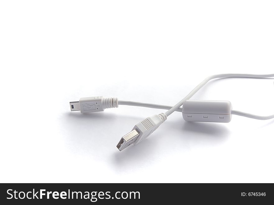 Cables USB and mini USB on white background