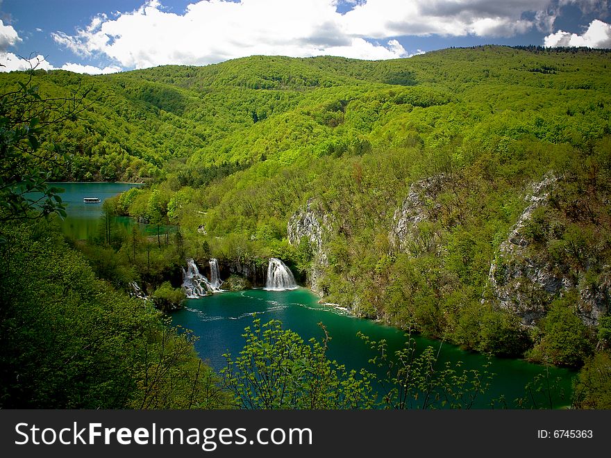 Clear mountain lakes with waterfall in green forest of national park plitvice, croatia. Clear mountain lakes with waterfall in green forest of national park plitvice, croatia