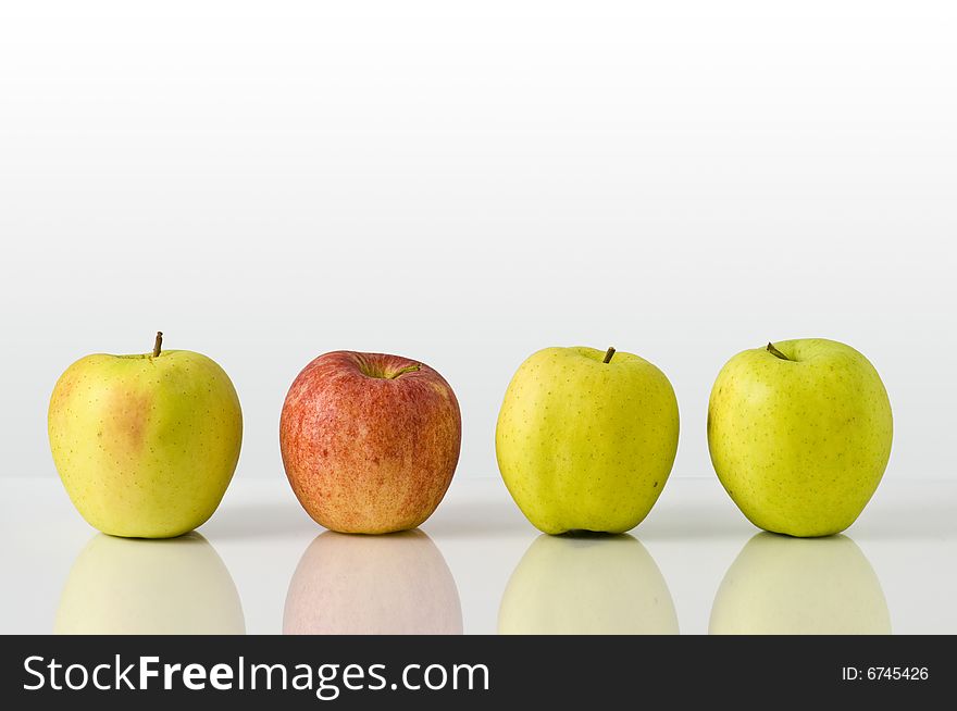 A composition of green apples and red apple