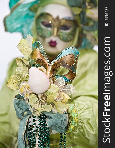 Colorful costumes at the Venice Carnival. Focus on the mask. Colorful costumes at the Venice Carnival. Focus on the mask