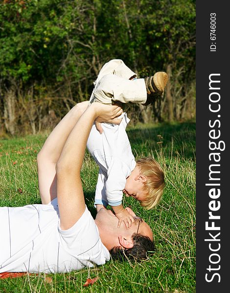 Father and son outdoor portrait. Father and son outdoor portrait