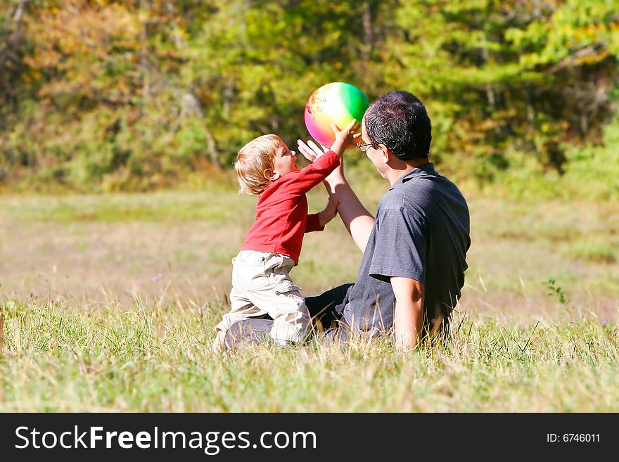 Father playing with son outdoors