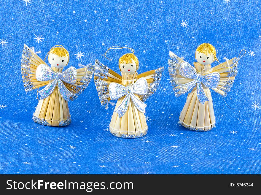 Three straw christmas angels - seasonal decoration - close up
