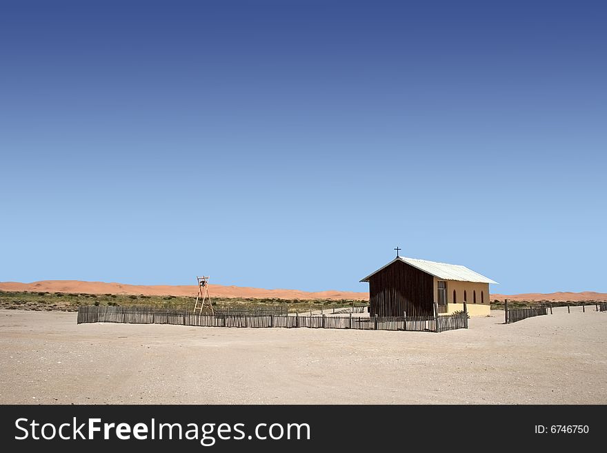 Remote church in namib desert with clear blue sky and red dunes in background,Namibia. Remote church in namib desert with clear blue sky and red dunes in background,Namibia