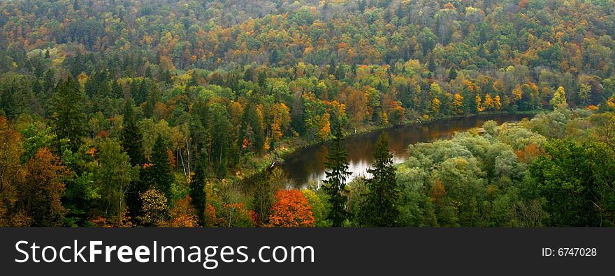 Colorful autumn valley with river