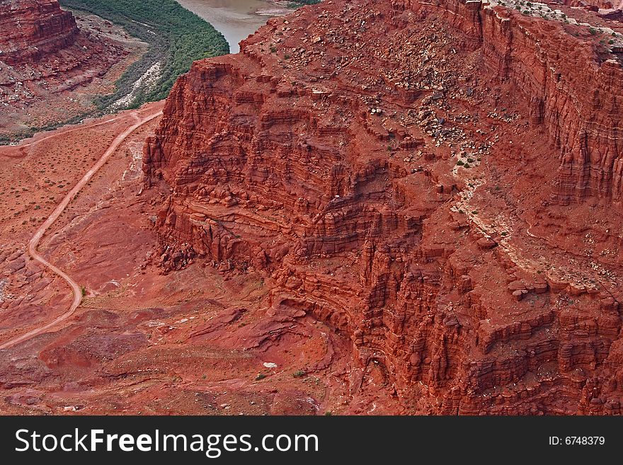 Close-up of red rock butte exposing the geological strata caused by erosion over the millennia. Close-up of red rock butte exposing the geological strata caused by erosion over the millennia