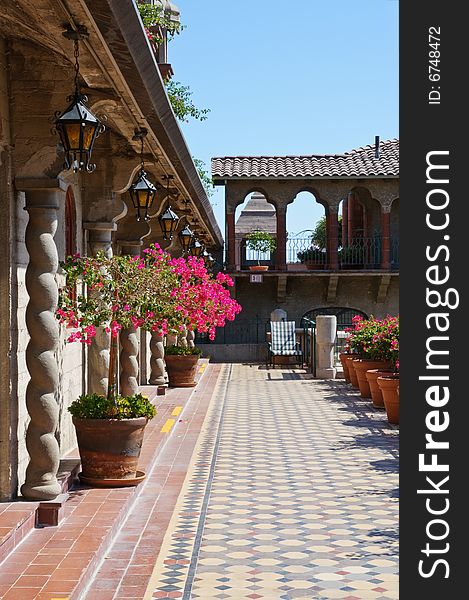 Vintage Spanish style architecture in California - terrace with column perspective