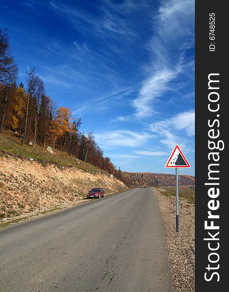 Autumn landscape with road in Ural mountains Russia