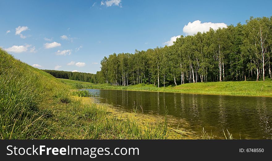 Lake near the forest and meadow.
Sunny day with beautiful sky.
Russia, Summer 2008. Lake near the forest and meadow.
Sunny day with beautiful sky.
Russia, Summer 2008.