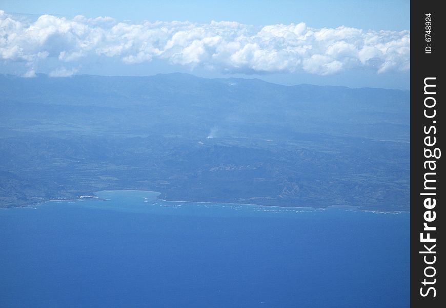 Ocean and land viewed from a plane
