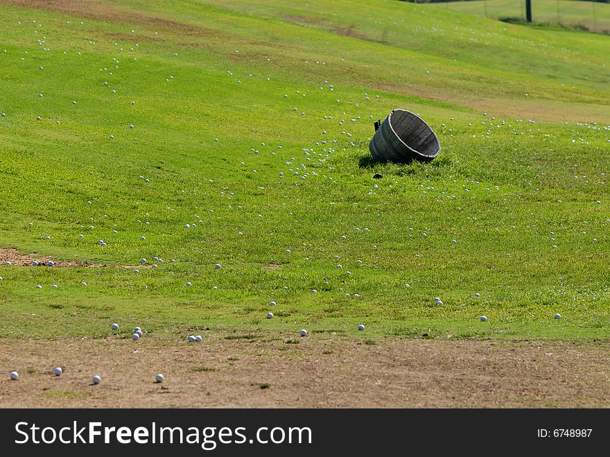 Golf balls on green grass field