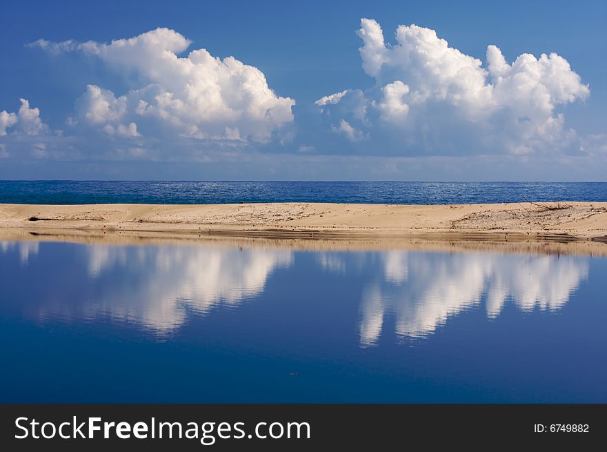 Tropical Shoreline With Clouds