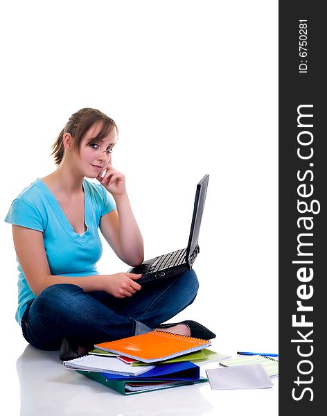 Teenager schoolgirl with laptop on white background