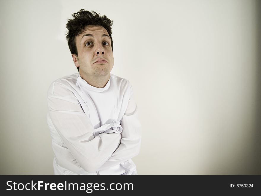 Disturbed young man with straitjacket. Disturbed young man with straitjacket