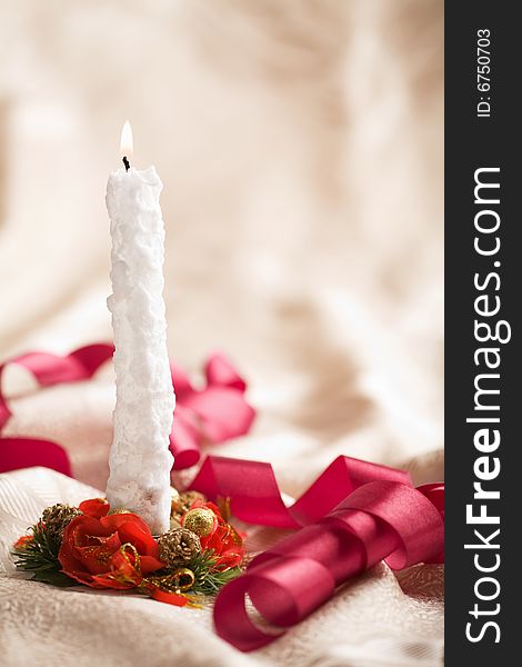 Burning candle and christmas accessories. holiday background