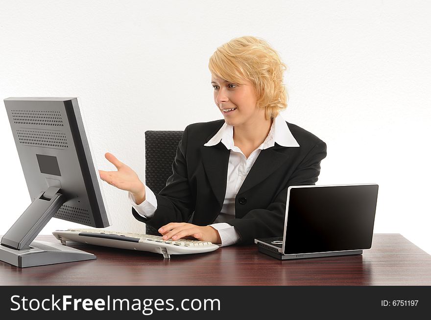 Young business woman working in a modern office.Isolated over white.