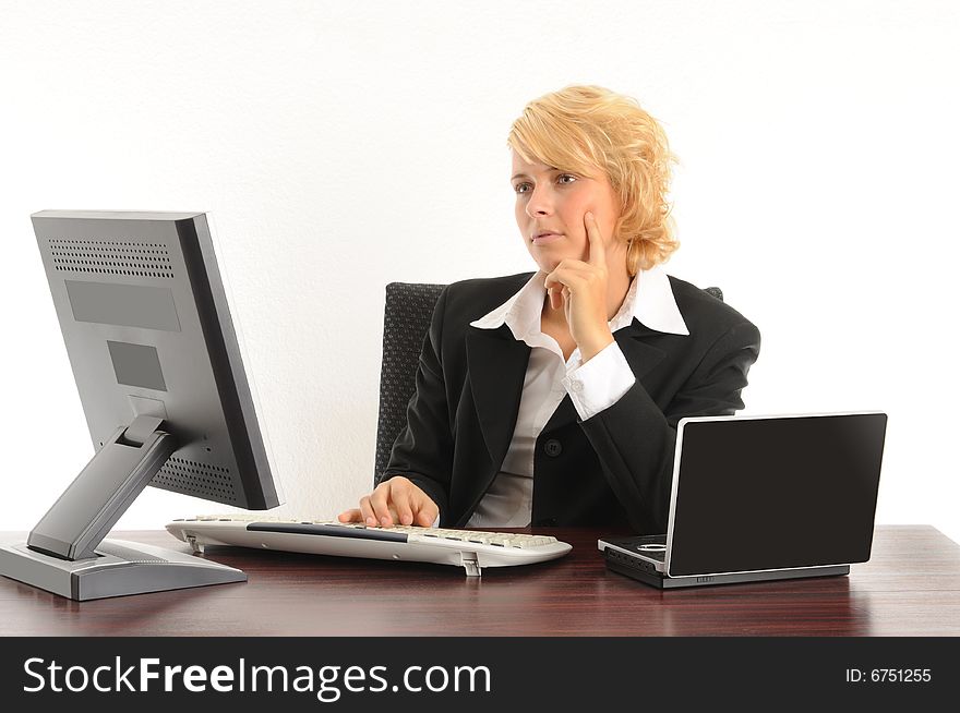 Young business woman working in a modern office.Isolated over white.