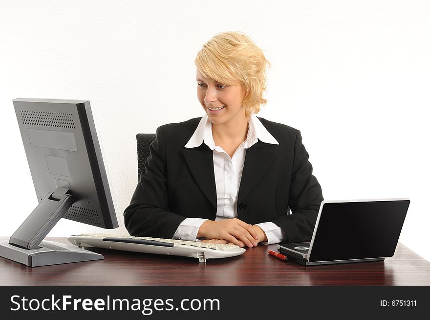 Young business woman working in a modern office.Isolated over white.