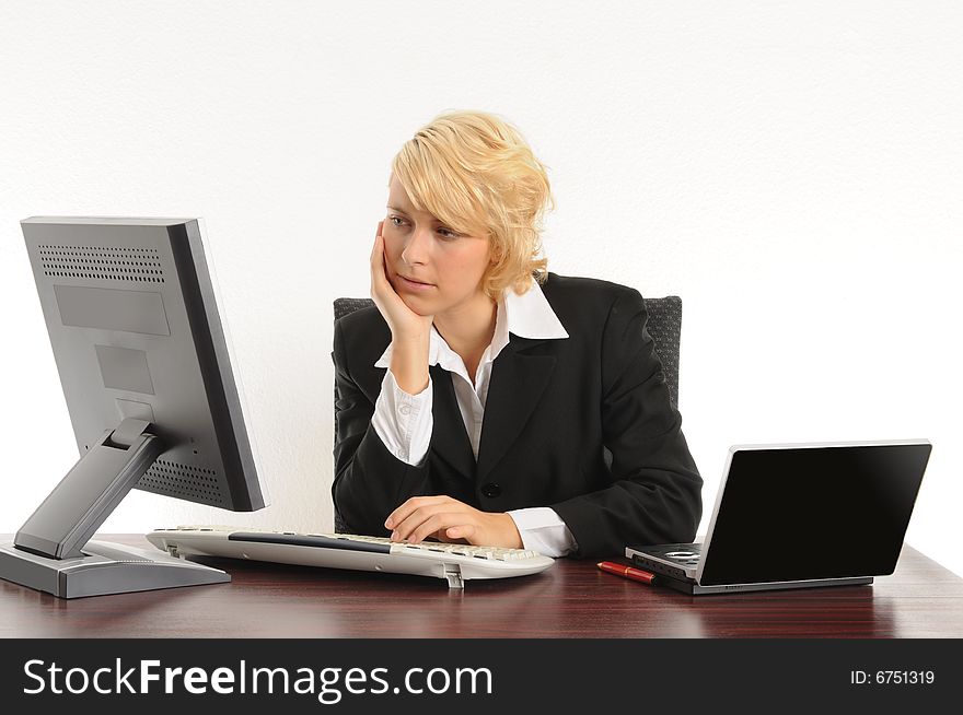 Young business woman working in a modern office.Isolated over white.