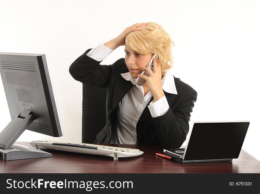 Young business woman working in a modern office.Isolated over white.