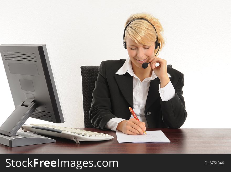 Young business woman working in a modern office.Isolated over white.