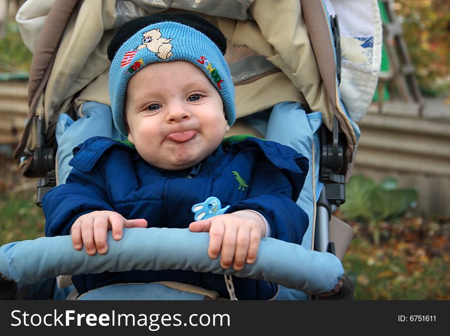 Little boy has put out tongue