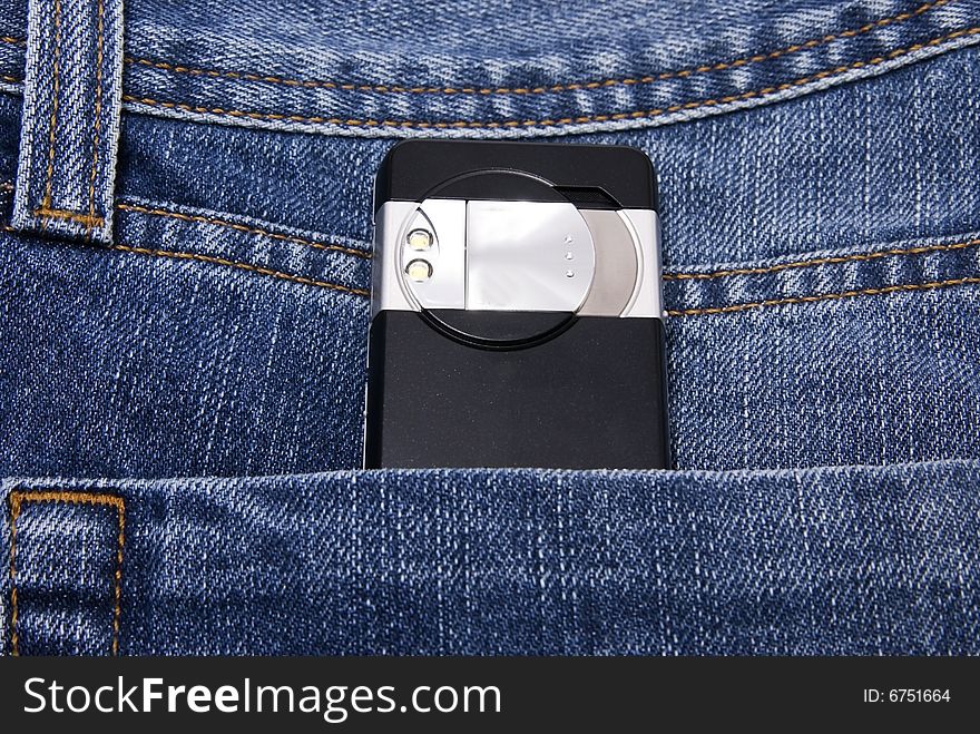 Digital camera of mobile phone in jeans pocket. Digital camera of mobile phone in jeans pocket