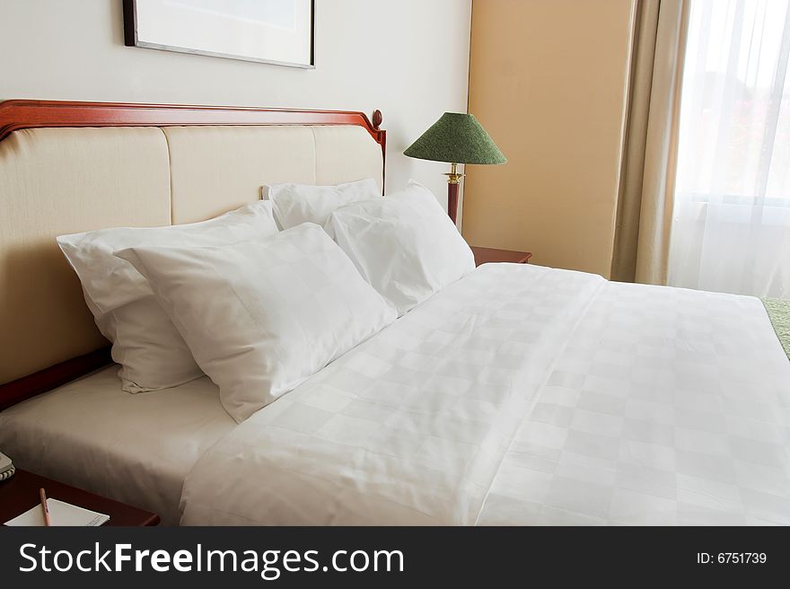 Photograph of luxury five star hotel king size bed