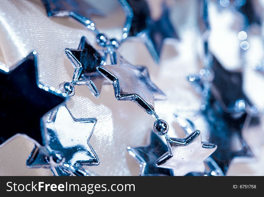 Holiday series: close up of blue christmas star garland. Holiday series: close up of blue christmas star garland