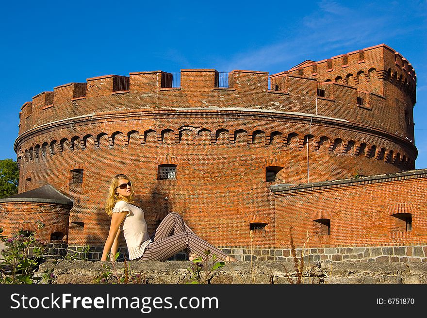 Girl posing near ancient fort. Girl posing near ancient fort