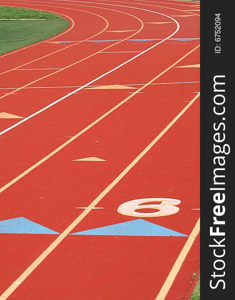 Red running track lanes background