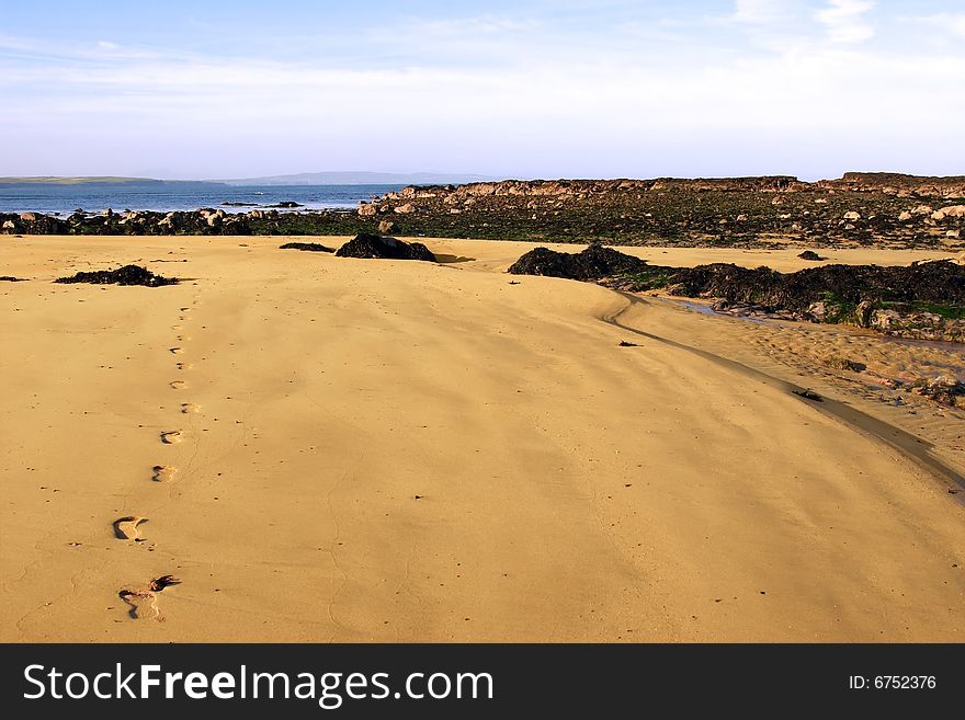 A scenic view of footprints on beautiful ballybunion beach in kerry ireland. A scenic view of footprints on beautiful ballybunion beach in kerry ireland