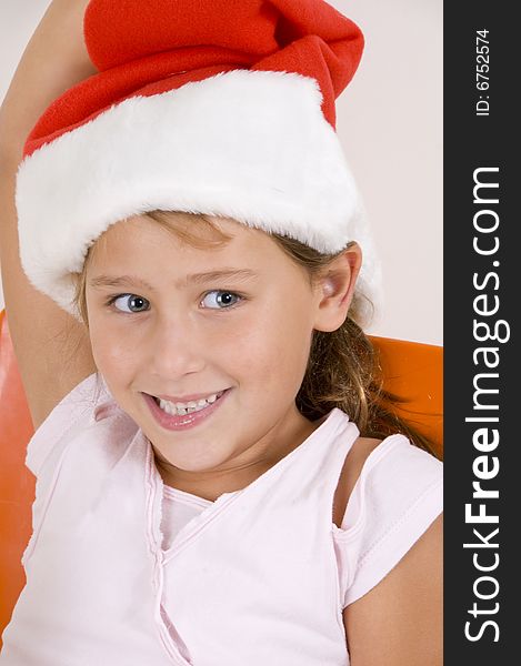 A smiling little girl with christmas hat