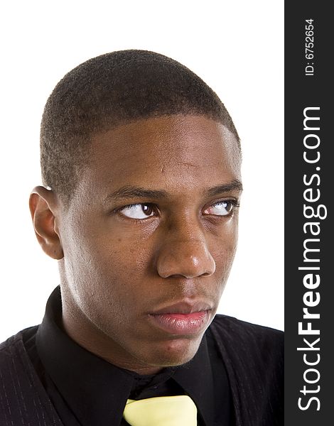 A nice young black man in a blackshirt and yellow tie looking up and left. A nice young black man in a blackshirt and yellow tie looking up and left