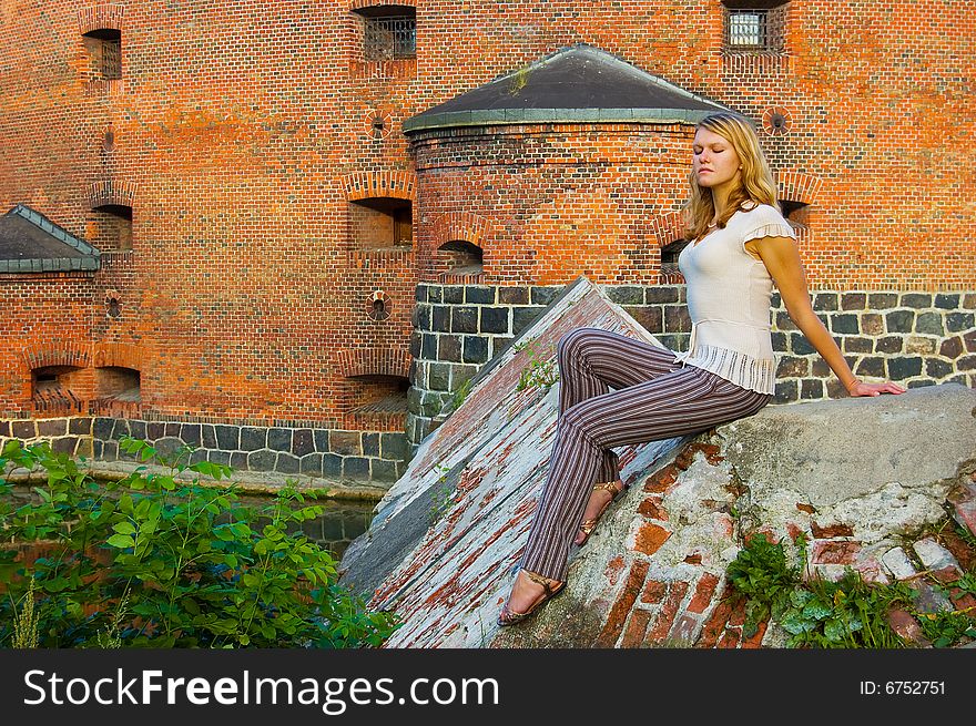 Girl posing near ancient fort. Girl posing near ancient fort